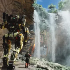 Potężny mech z gry Titanfall 3 stoi obok wodospadu, a pilot w skafandrze bojowym wpatruje się w niego.
