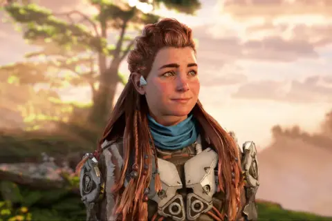 Aloy z gry Horizon w zbroi, z warkoczami i niebieską chustą, na tle zachodzącego słońca.