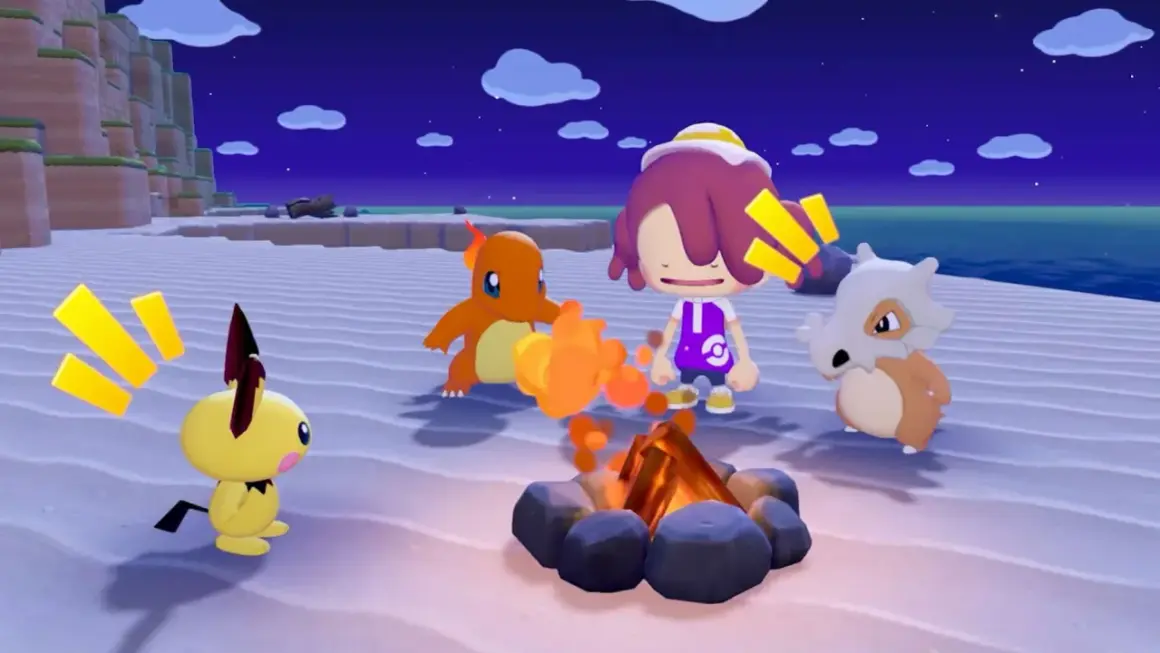 Pikachu, Charmander i Cubone przy ognisku na plaży. W tle nocne niebo i klify. To scena z gry Pokemon.