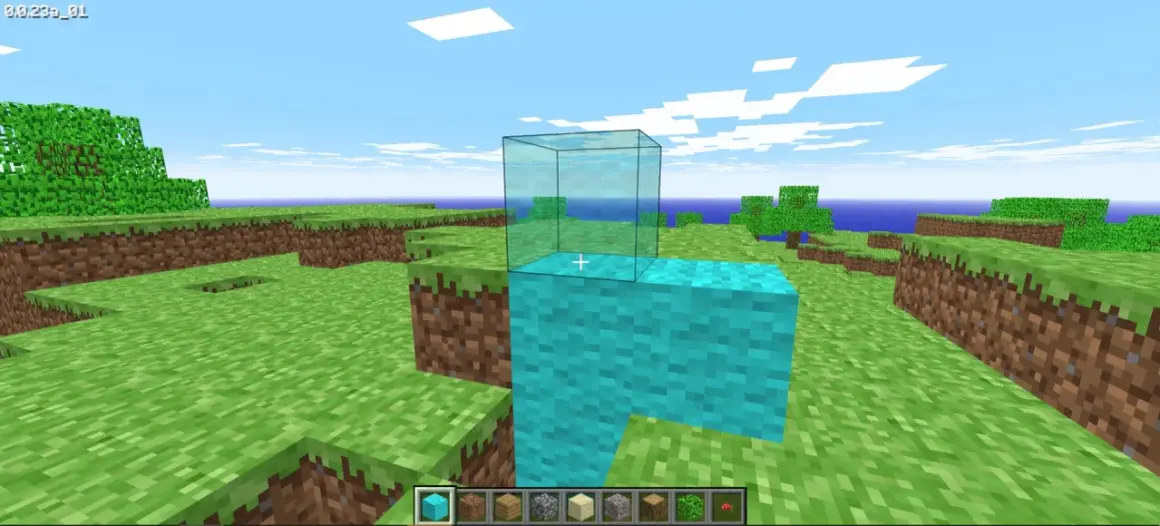 Gra w **minecraft w przeglądarce**. Gracz buduje wieżę z niebieskich bloków, na której stawia szklaną ścianę.