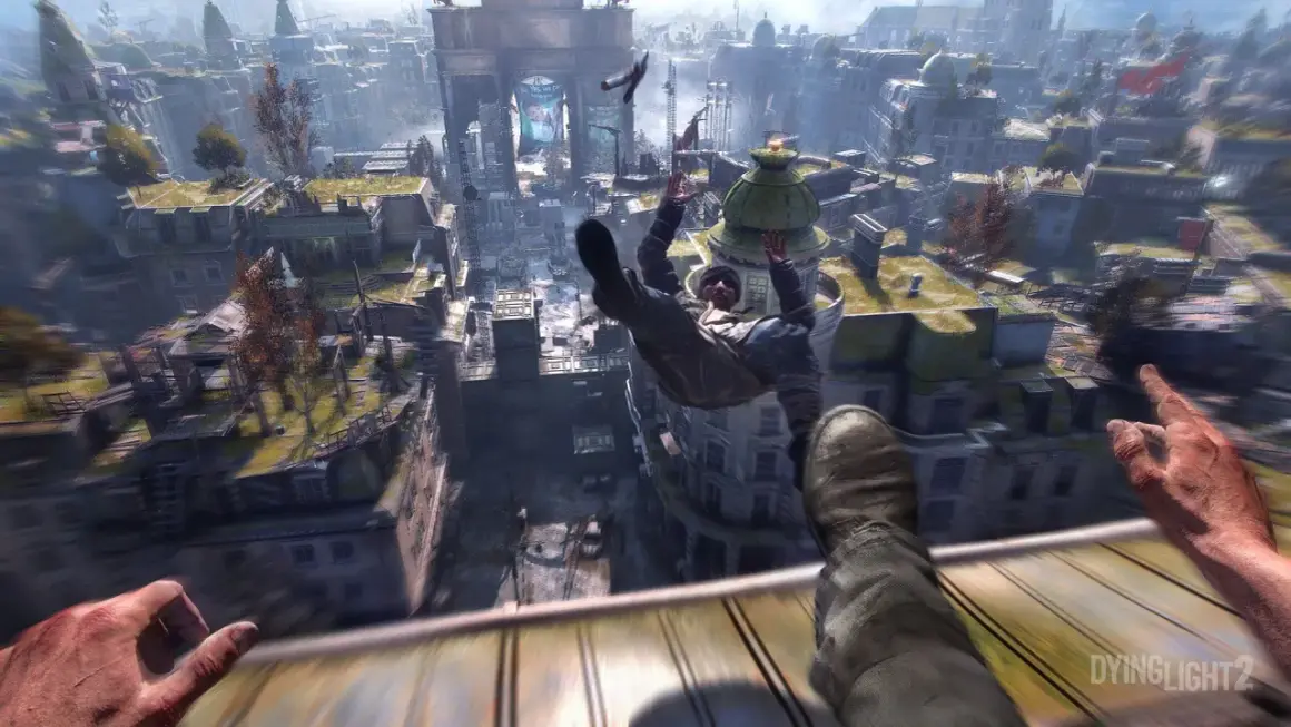Gracz w grze Dying Light 2 spada z dachu, a miasto rozciąga się pod nim. Sprawdź Dying Light wymagania!