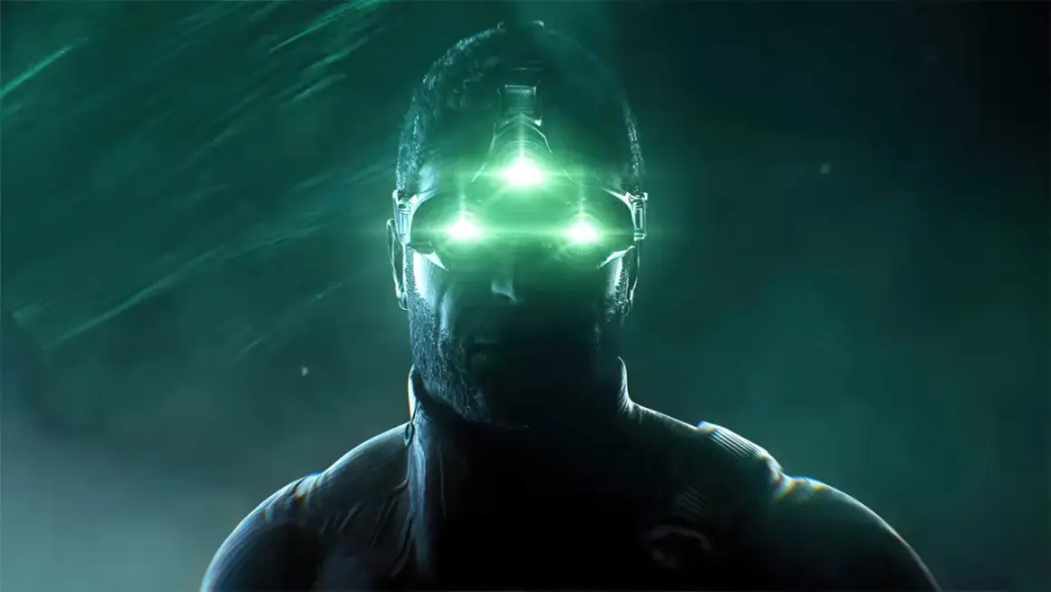 Sam Fisher w okularach z zielonymi światłami, gotowy do akcji w splinter cell remake.