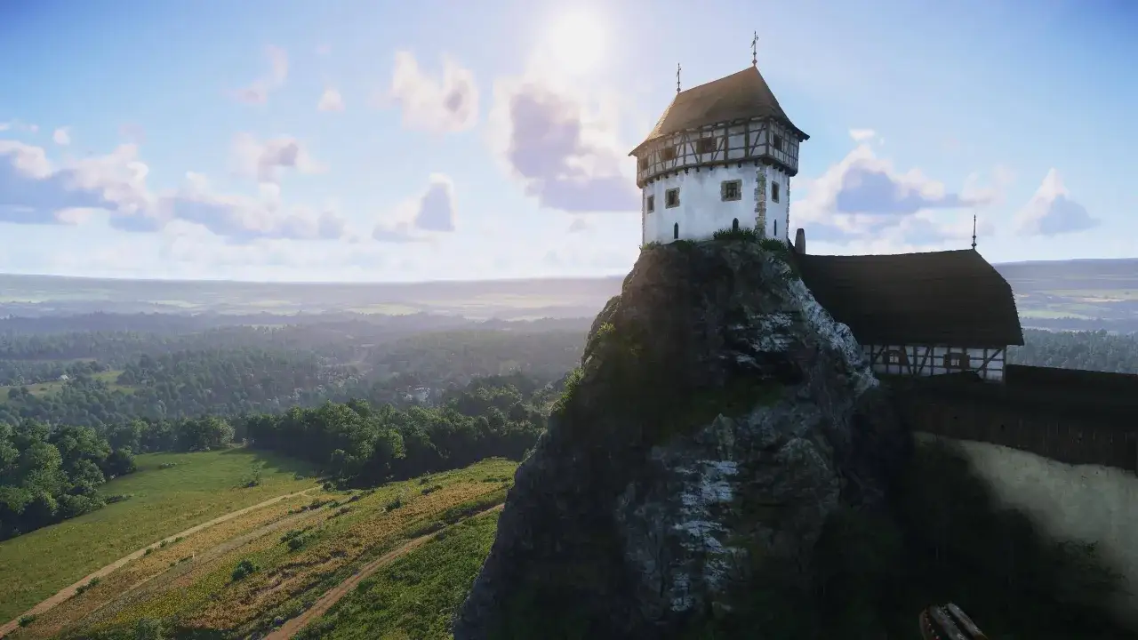 Widok na zamek z gry Kingdom Come: Deliverance. Czas gry toczy się w malowniczej krainie, gdzie czeka Cię wiele przygód.