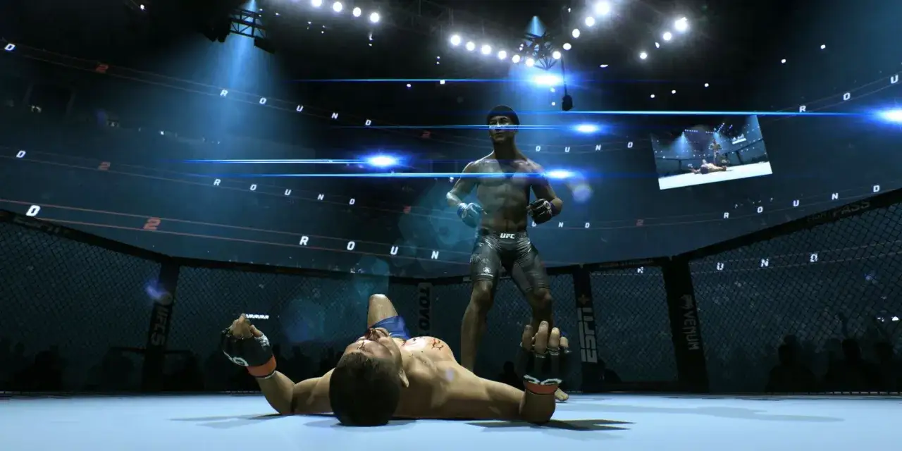 Zwycięzca UFC na PC stoi nad pokonanym rywalem w ringu.
