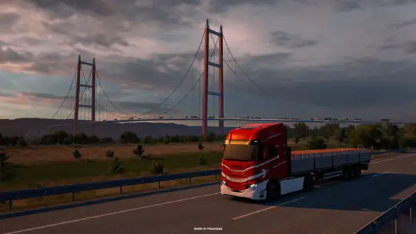 Czerwona ciężarówka na moście, zachód słońca. Idealna grafika do sprawdzenia wymagań Euro Truck Simulator 2.