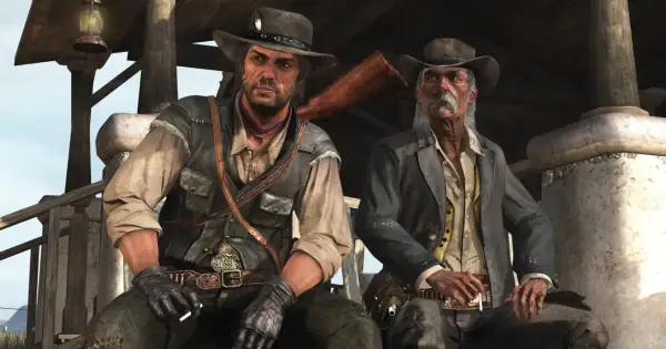 Dwóch kowbojów, jeden młodszy, drugi starszy, siedzi pod wiatą. Scena z gry Red Dead Redemption 2 PC.