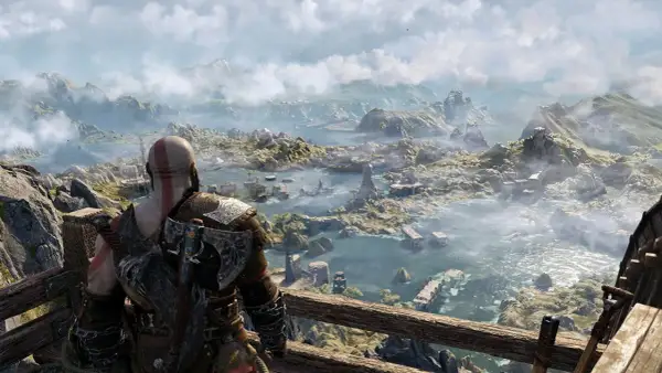 Kratos spogląda na rozległy krajobraz, zastanawiając się, ile godzin zajmie mu odkrycie wszystkich tajemnic tego świata w God of War.
